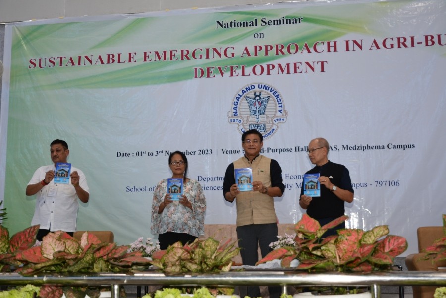 Mhathung Yanthan releasing the Abstracts book